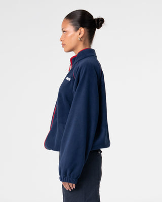 Woman wearing Bound Zip Through Fleece in Navy Blue
