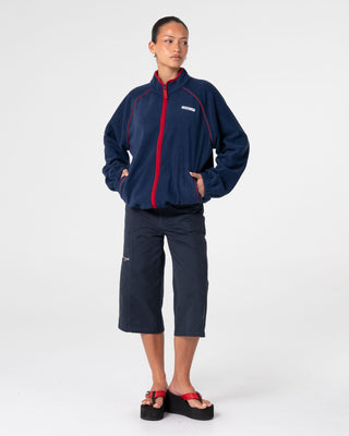 Woman wearing Bound Zip Through Fleece in Navy Blue