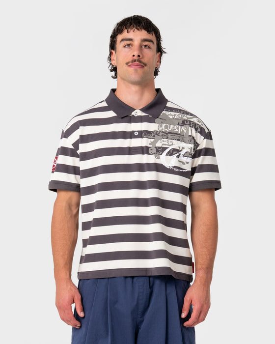 man-wearing-thrasha-short-sleeve-polo-in-carbon