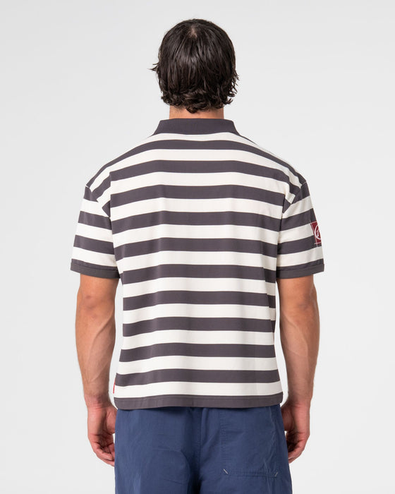 man-wearing-thrasha-short-sleeve-polo-in-carbon