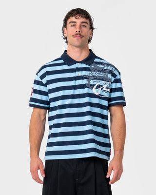 Man wearing Thrasha Short Sleeve Polo in Ice Blue