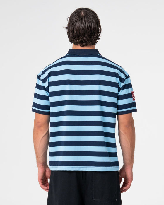 man-wearing-thrasha-short-sleeve-polo-in-ice-blue