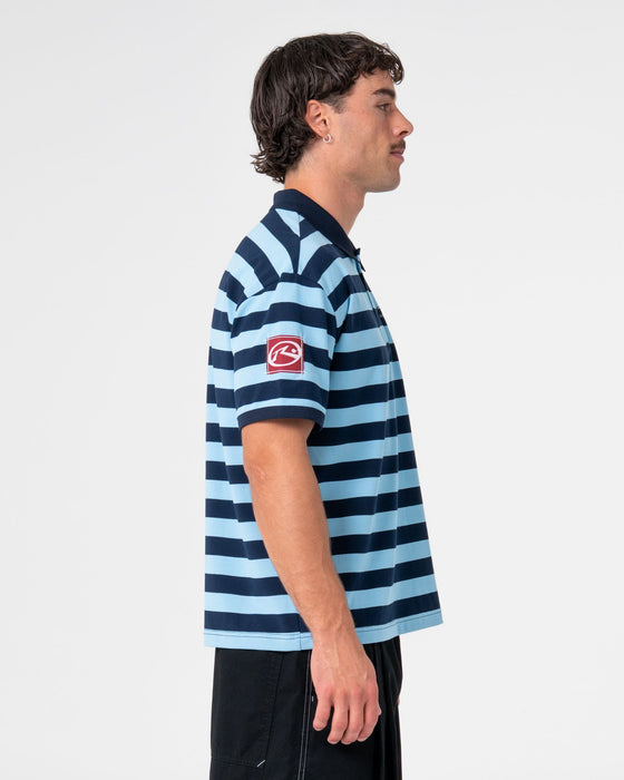 man-wearing-thrasha-short-sleeve-polo-in-ice-blue