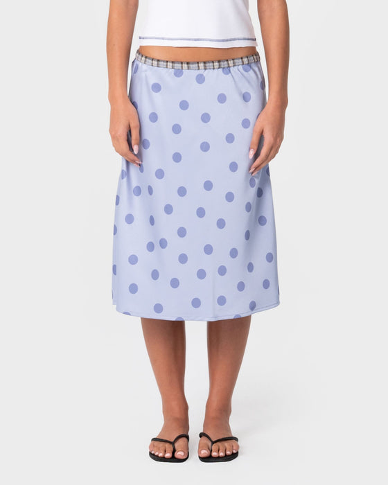 woman-wearing-claudi-low-rise-midi-skirt-in-cornflower-blue