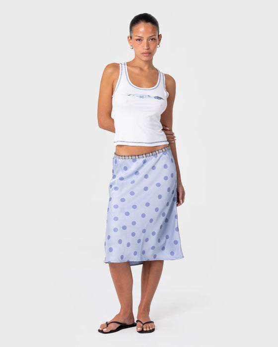woman-wearing-claudi-low-rise-midi-skirt-in-cornflower-blue