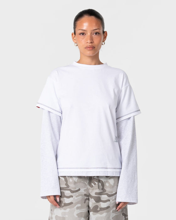 woman-wearing-lara-mock-long-sleeve-relaxed-tee-in-white