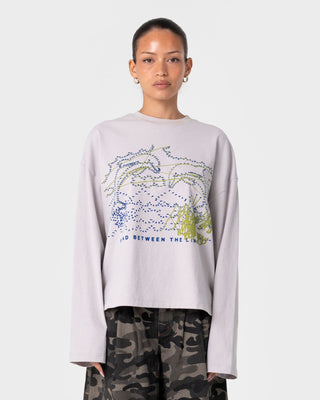 Woman wearing Coco Long Sleeve Relaxed Tee in Oyster Grey