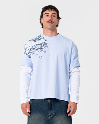 Man wearing Kodak Walk Mock Long Sleeve Tee in Ice Blue