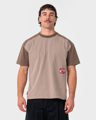 Man wearing Weagle Short Sleeve Tee in Stone