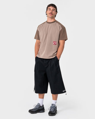 Man wearing Weagle Short Sleeve Tee in Stone