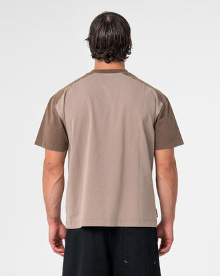 Man wearing Weagle Short Sleeve Tee in Stone