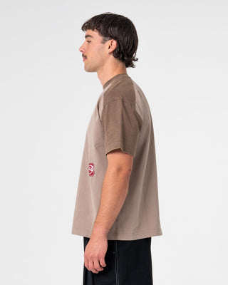 Man wearing Weagle Short Sleeve Tee in Stone