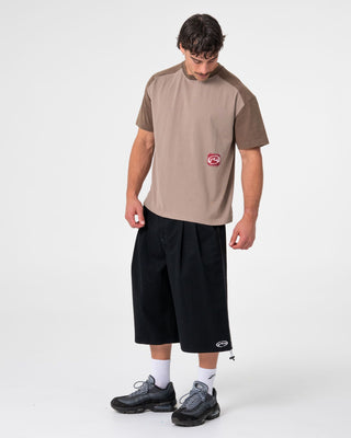 Man wearing Weagle Short Sleeve Tee in Stone