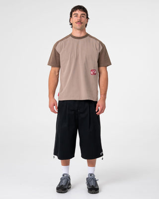 Man wearing Weagle Short Sleeve Tee in Stone