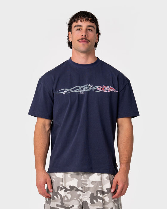 man-wearing-dragon-boosta-short-sleeve-tee-in-dark-blue