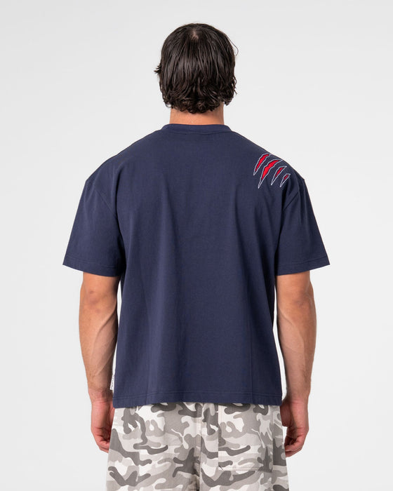 man-wearing-dragon-boosta-short-sleeve-tee-in-dark-blue