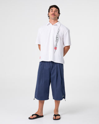 Man wearing Mamba 3/4 Baggy Short in Dark Blue