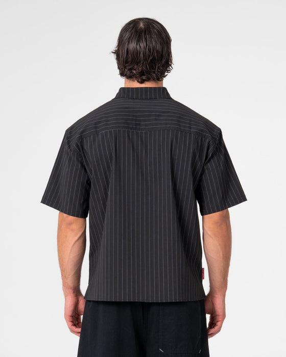 man-wearing-mystika-short-sleeve-shirt-in-black