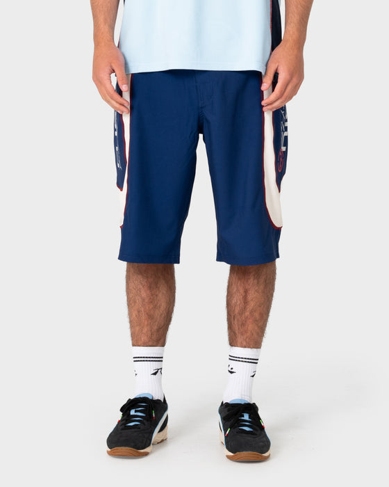 model-wearing-drop-in-fixed-waist-boardshort-in-navy-blue