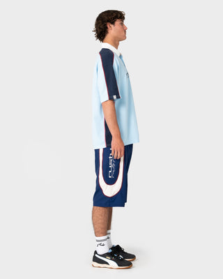 Model wearing Drop In Fixed Waist Boardshort in Navy Blue