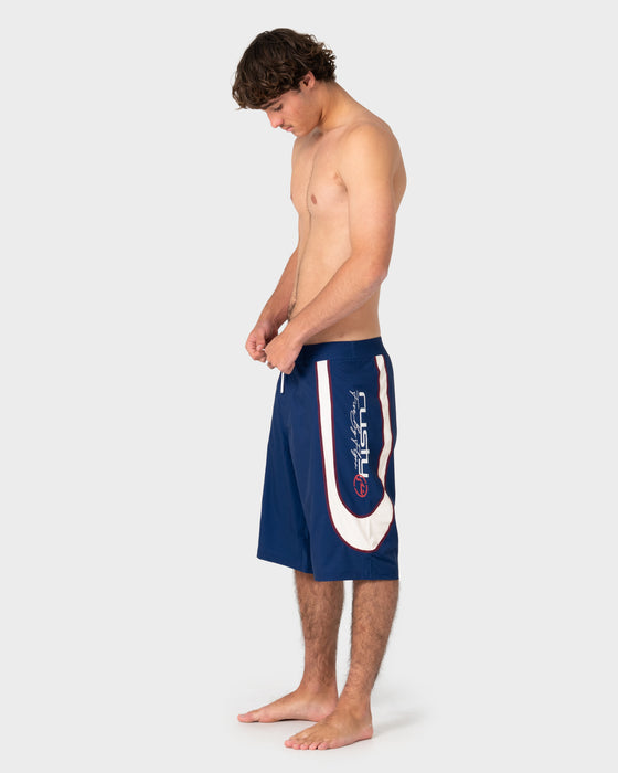 model-wearing-drop-in-fixed-waist-boardshort-in-navy-blue
