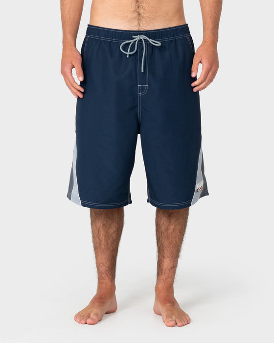 man-wearing-rusty-x-halco-24-elastic-waist-boardshort-in-navy-blue