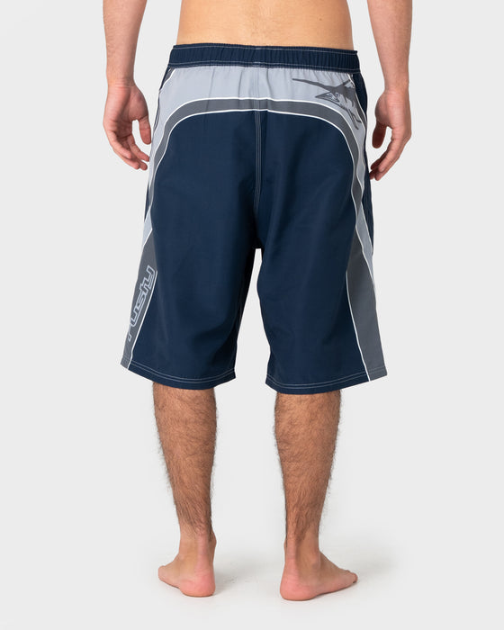 man-wearing-rusty-x-halco-24-elastic-waist-boardshort-in-navy-blue