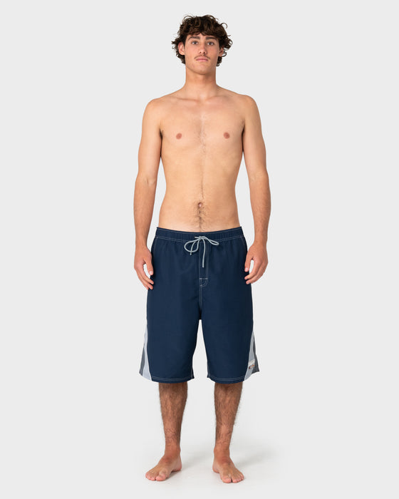 man-wearing-rusty-x-halco-24-elastic-waist-boardshort-in-navy-blue