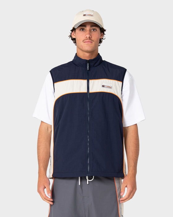 man-wearing-rusty-x-halco-fleece-vest-in-navy-blue