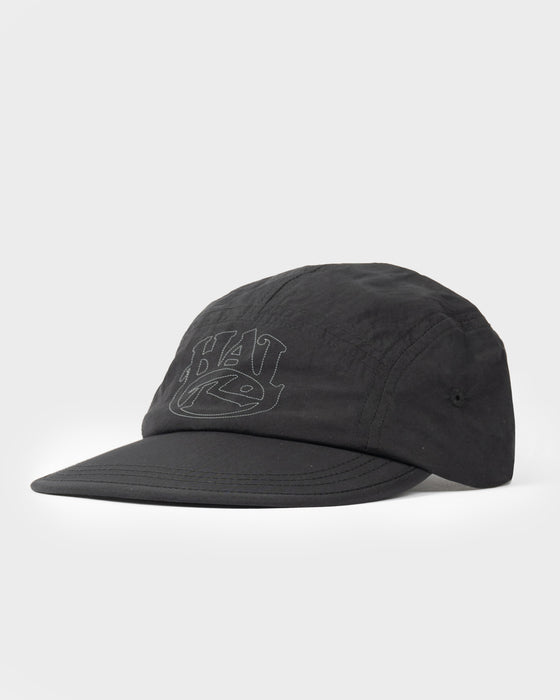 model-wearing-hal-x-rusty-nylon-5-panel-cap-in-black