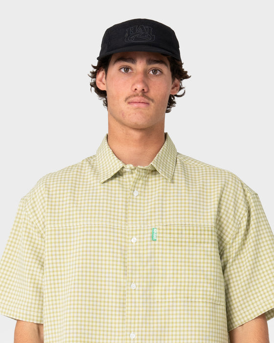 model-wearing-hal-x-rusty-nylon-5-panel-cap-in-black