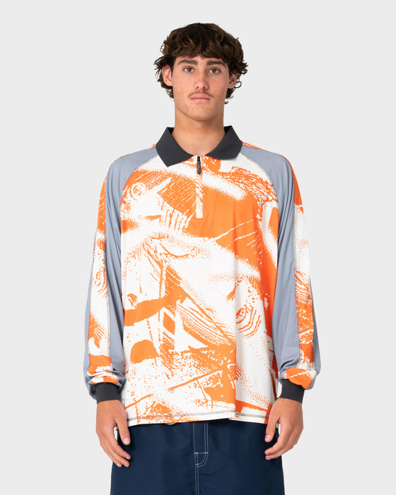 man-wearing-rusty-x-halco-long-sleeve-fishing-polo-in-orange