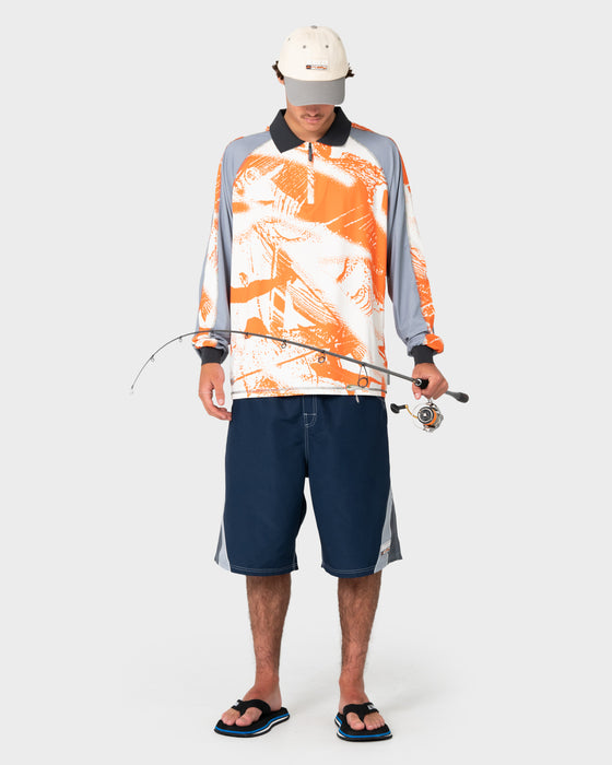 man-wearing-rusty-x-halco-long-sleeve-fishing-polo-in-orange