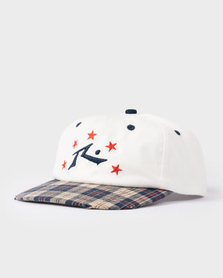 model-wearing-rusty-x-five-by-flynn-cap-in-plaid