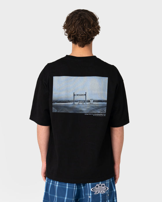 model-wearing-king-waves-kill-short-sleeve-tee-in-black
