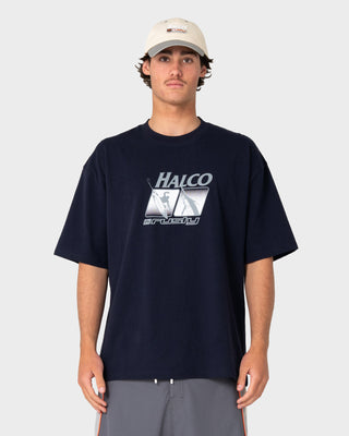 Man wearing Rusty x Halco Short Sleeve Tee in Navy Blue