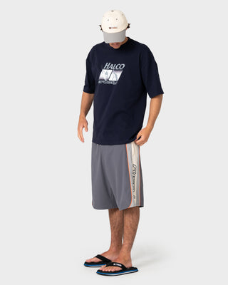 Man wearing Rusty x Halco Short Sleeve Tee in Navy Blue