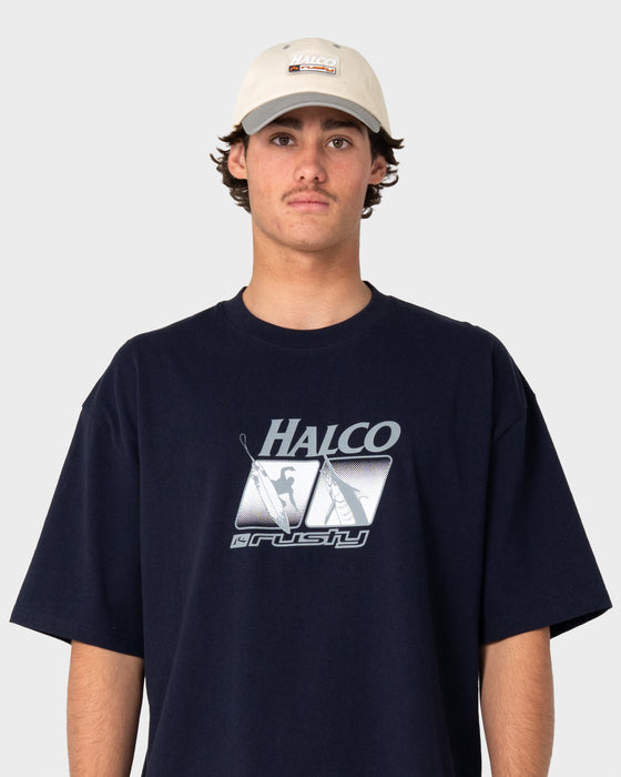 man-wearing-rusty-x-halco-short-sleeve-tee-in-navy-blue