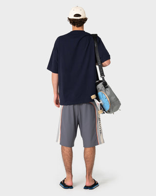 Man wearing Rusty x Halco Short Sleeve Tee in Navy Blue