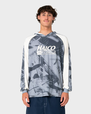 Man wearing Rusty x Halco Long Sleeve Hooded Tee in Stone Grey