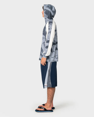 Man wearing Rusty x Halco Long Sleeve Hooded Tee in Stone Grey
