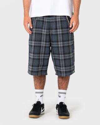 Model wearing Flop Drop Elastic Baggy Walkshort in Navy Blue