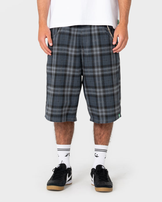 model-wearing-flop-drop-elastic-baggy-walkshort-in-navy-blue