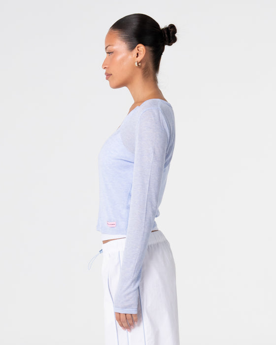 woman-wearing-henry-henley-long-sleeve-top-in-sail-blue