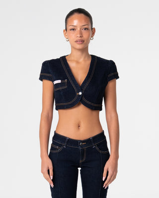 Woman wearing Muse Me Denim Bolero Top in Raw Dawg Blue