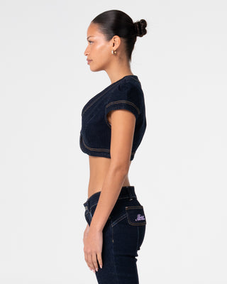 Woman wearing Muse Me Denim Bolero Top in Raw Dawg Blue