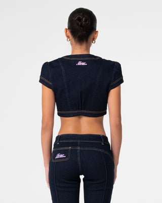 Woman wearing Muse Me Denim Bolero Top in Raw Dawg Blue