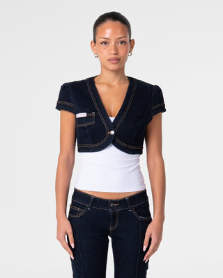 Woman wearing Muse Me Denim Bolero Top in Raw Dawg Blue