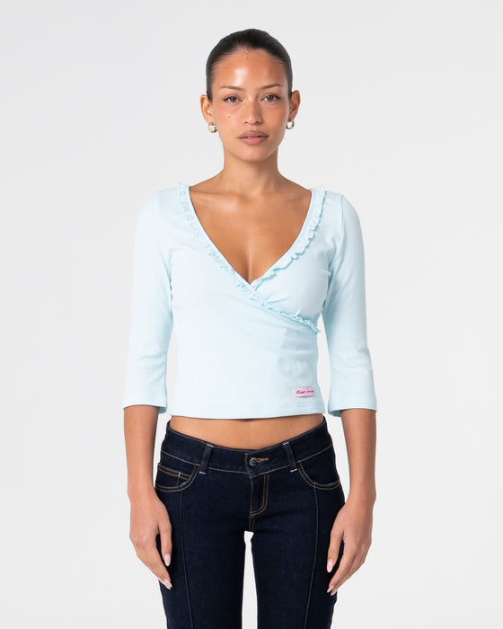 woman-wearing-naomi-deep-vee-3-4-sleeve-top-in-pale-mint