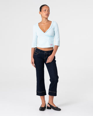 Woman wearing Naomi Deep Vee 3/4 Sleeve Top in Pale Mint
